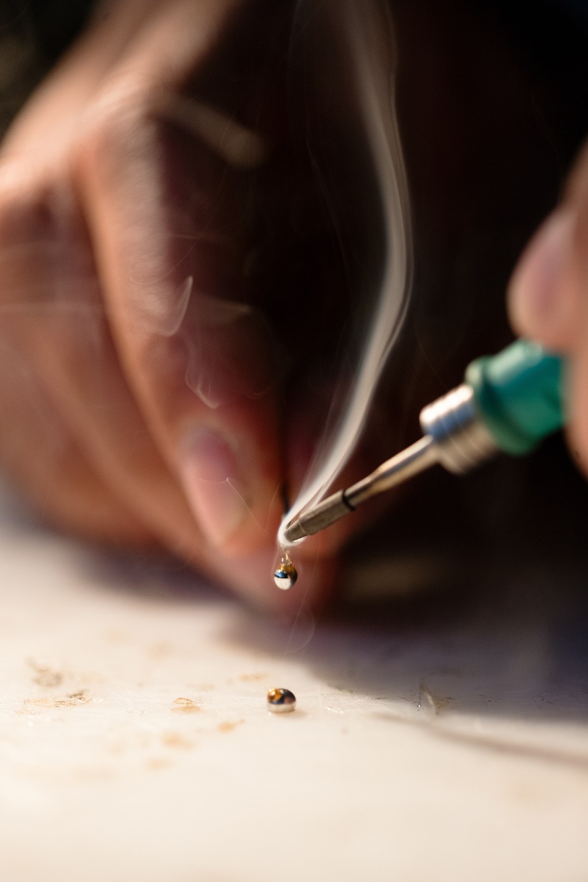 close up of someone using a soldering iron